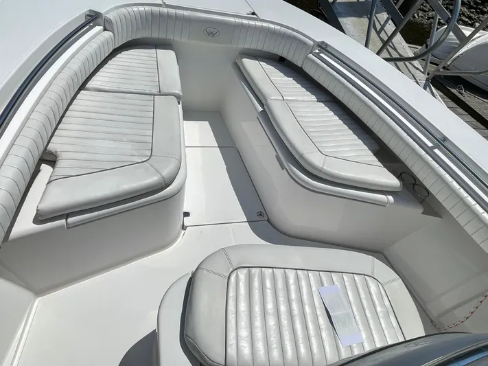  Yacht Photos Pics 2014 Southport 27 Center Console boat with white cushioned seating.