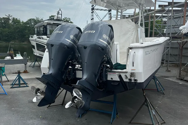  Yacht Photos Pics 2014 Southport 27 Center Console boat with twin 250 horsepower engines on a dock.