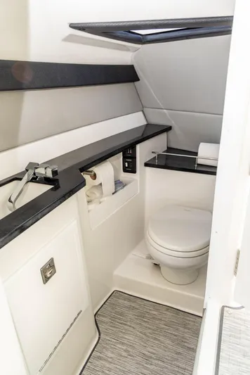  Yacht Photos Pics 2023 Cobalt R33 boat bathroom with modern fixtures and sleek design.