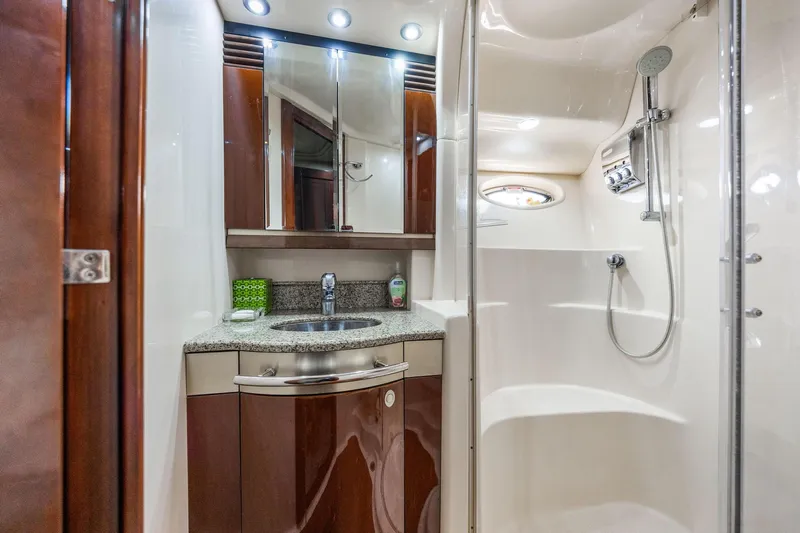 The Blue Fish Yacht Photos Pics Luxurious bathroom in 2007 Sea Ray 52 Sedan Bridge yacht with modern fixtures.