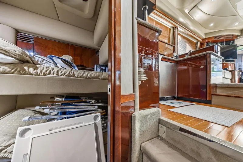 The Blue Fish Yacht Photos Pics Interior of 2007 Sea Ray 52 Sedan Bridge yacht with luxurious wood finishes.