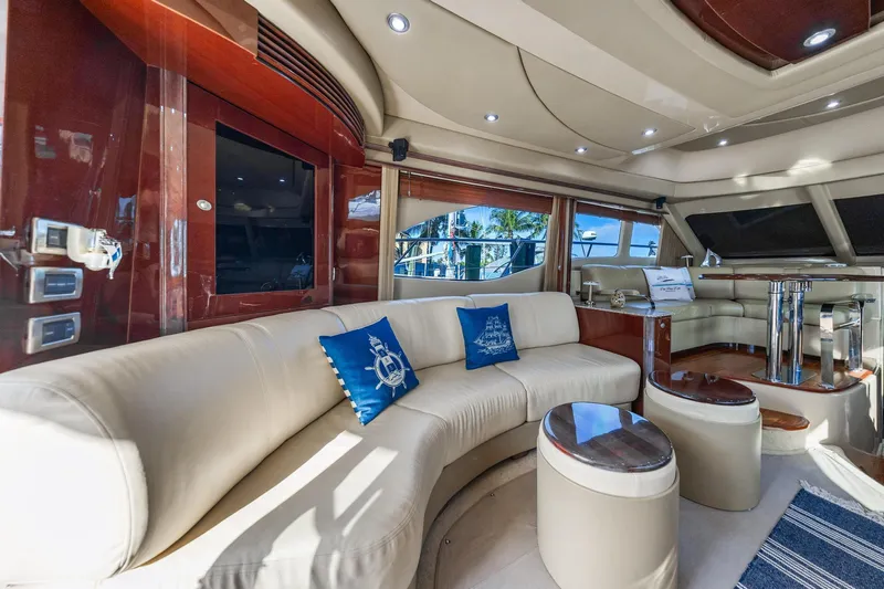 The Blue Fish Yacht Photos Pics Luxurious interior of 2007 Sea Ray 52 Sedan Bridge yacht with elegant seating and decor.