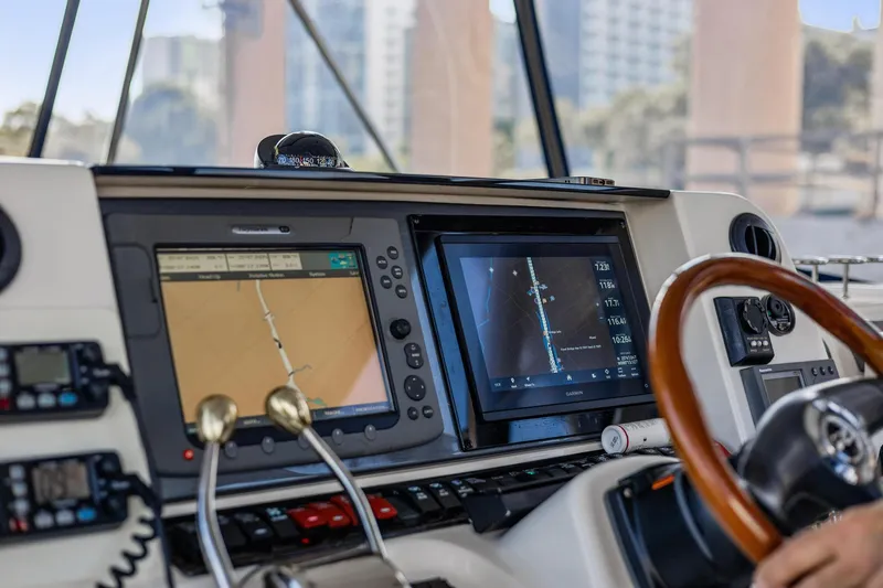 The Blue Fish Yacht Photos Pics 2007 Sea Ray 52 Sedan Bridge helm with navigation screens and controls.