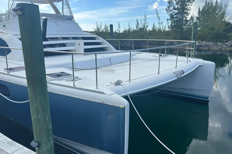 Shearwater Yacht Photos Pics 2011 Leopard 47 Powercat docked, featuring spacious deck and sleek design.