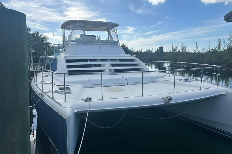 Shearwater Yacht Photos Pics 2011 Leopard 47 Powercat yacht docked, featuring spacious deck and sleek design.