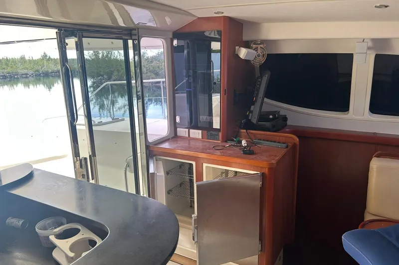 Shearwater Yacht Photos Pics Interior of 2011 Leopard 47 Powercat yacht with open doors and modern amenities.