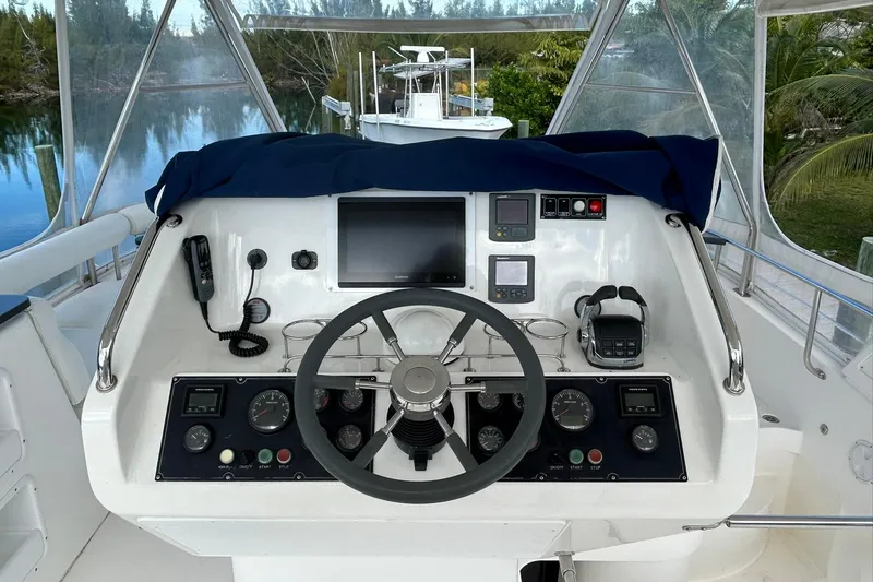 Shearwater Yacht Photos Pics Cockpit of 2011 Leopard 47 Powercat with steering wheel and navigation controls.