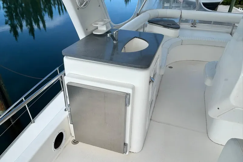 Shearwater Yacht Photos Pics 2011 Leopard 47 Powercat yacht deck with sink and seating area.