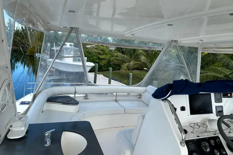 Shearwater Yacht Photos Pics 2011 Leopard 47 Powercat interior with helm, seating, and waterway view.