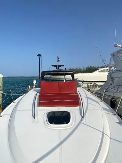 Red Scorpion Yacht Photos Pics 2007 Sea Ray 400 Sundancer yacht docked with red sunbathing cushions.