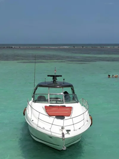 Red Scorpion Yacht Photos Pics 2007 Sea Ray 400 Sundancer yacht in clear turquoise waters.