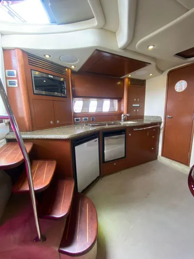 Red Scorpion Yacht Photos Pics Interior kitchen of 2007 Sea Ray 400 Sundancer yacht with modern amenities.