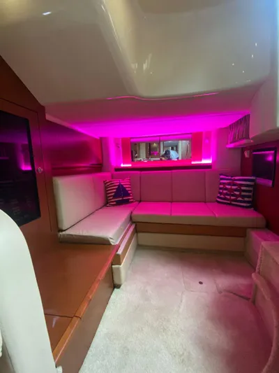 Red Scorpion Yacht Photos Pics Interior of 2007 Sea Ray 400 Sundancer with pink ambient lighting.