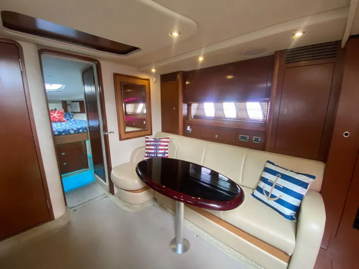 Red Scorpion Yacht Photos Pics Interior of 2007 Sea Ray 400 Sundancer yacht with seating area and table.