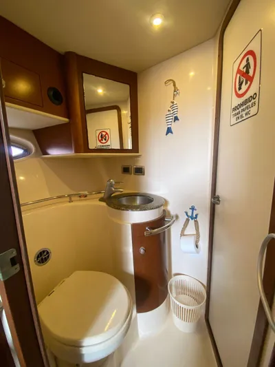 Red Scorpion Yacht Photos Pics 2007 Sea Ray 400 Sundancer bathroom with sink, toilet, and mirror.