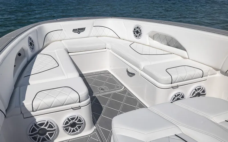  Yacht Photos Pics Luxurious seating area on 2024 Deep Impact 399 Sport boat with elegant white upholstery.