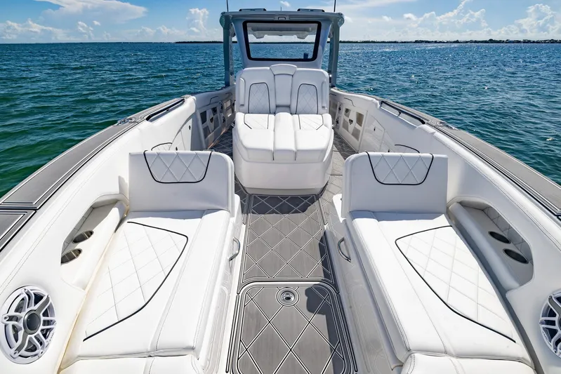  Yacht Photos Pics 2024 Deep Impact 399 Sport boat interior with luxurious white seating on open water.