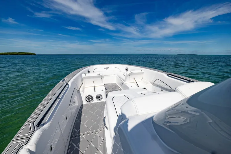  Yacht Photos Pics 2024 Deep Impact 399 Sport boat on open water under clear blue sky.