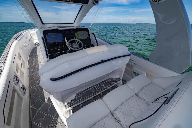  Yacht Photos Pics 2024 Deep Impact 399 Sport boat interior with luxurious seating and advanced navigation system.