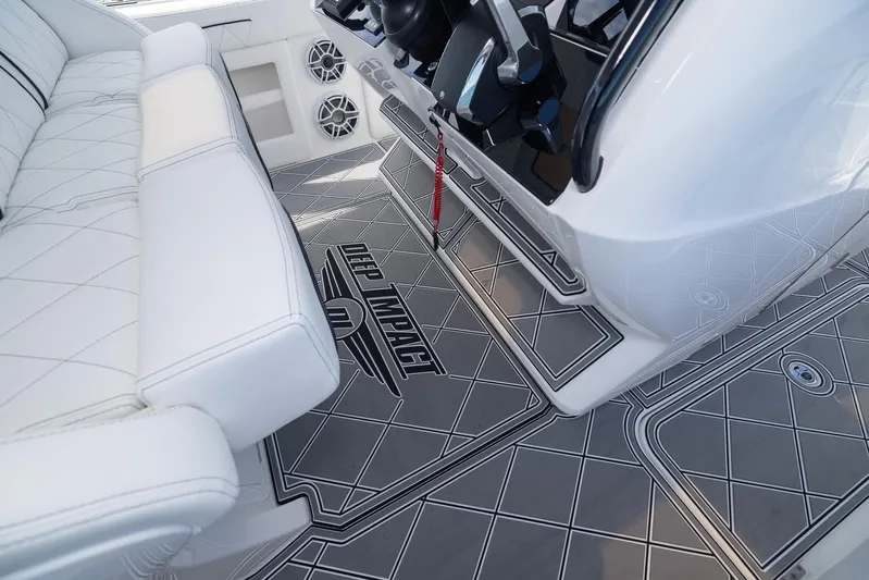  Yacht Photos Pics 2024 Deep Impact 399 Sport boat interior with stylish seating and custom flooring design.