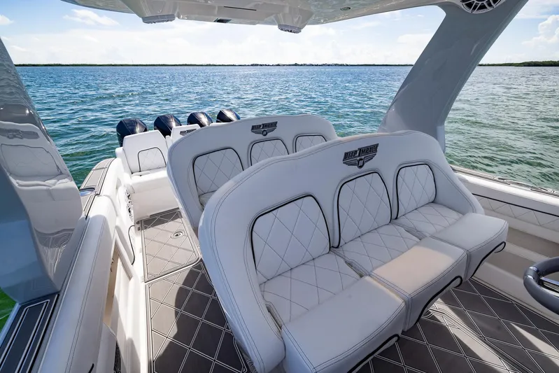  Yacht Photos Pics 2024 Deep Impact 399 Sport boat interior with luxurious seating on open water.
