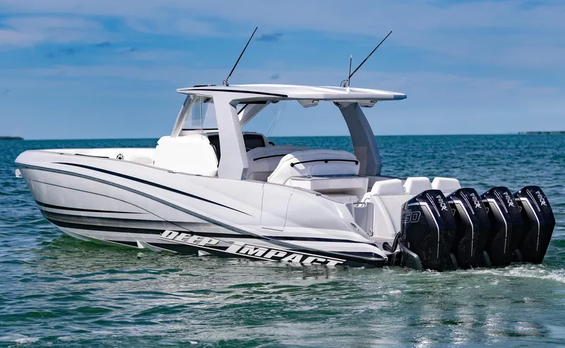  Yacht Photos Pics 2024 Deep Impact 399 Sport boat cruising on clear blue water.