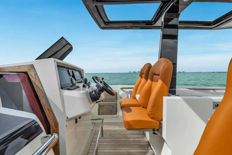 Elise Yacht Photos Pics 2017 Fjord 40 Open yacht cockpit with orange seats and ocean view.