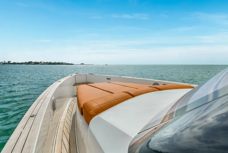 Elise Yacht Photos Pics 2017 Fjord 40 Open yacht with tan seating, cruising on calm waters under a clear sky.