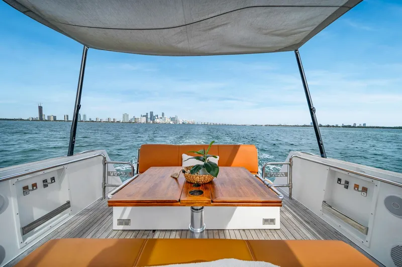 Elise Yacht Photos Pics 2017 Fjord 40 Open yacht with city skyline view, featuring a stylish deck and seating area.