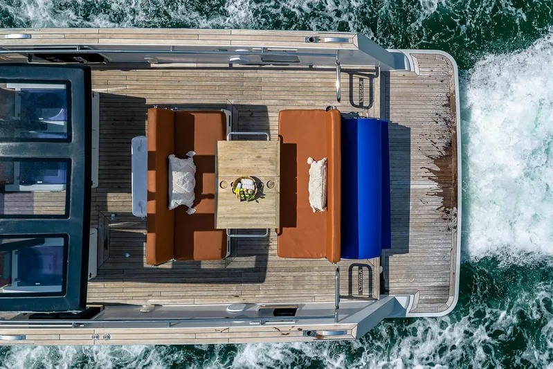 Elise Yacht Photos Pics Aerial view of 2017 Fjord 40 Open yacht with deck seating and table.