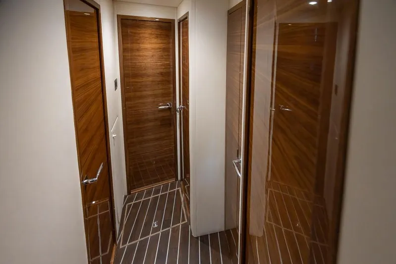 Seven Seas Yacht Photos Pics Luxurious wooden interior hallway of 2024 Viking 58 Convertible yacht.