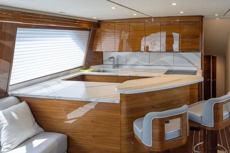 Seven Seas Yacht Photos Pics Luxurious interior of 2024 Viking 58 Convertible yacht with modern kitchen design.