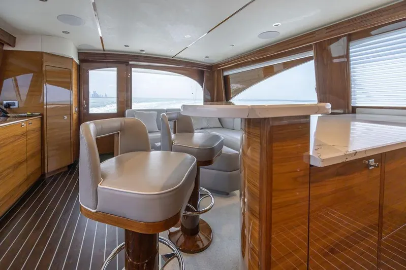 Seven Seas Yacht Photos Pics Luxurious interior of 2024 Viking 58 Convertible yacht with elegant wood finishes.