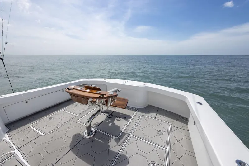 Seven Seas Yacht Photos Pics 2024 Viking 58 Convertible yacht deck overlooking the ocean under a clear sky.