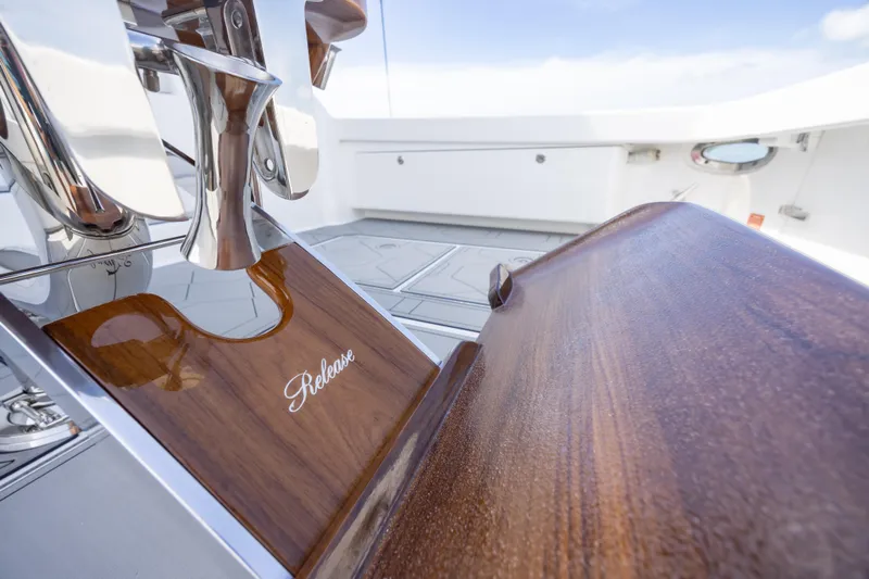 Seven Seas Yacht Photos Pics 2024 Viking 58 Convertible yacht with polished wood and chrome details, featuring "Release" branding.