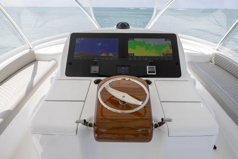 Seven Seas Yacht Photos Pics 2024 Viking 58 Convertible yacht helm with advanced navigation displays and sleek design.