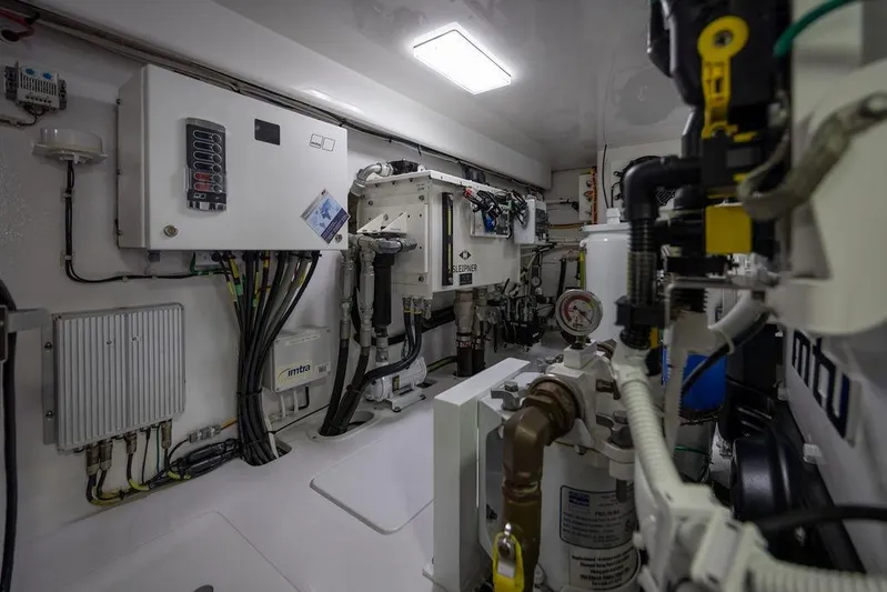 Seven Seas Yacht Photos Pics Engine room of 2024 Viking 58 Convertible yacht, showcasing advanced machinery and wiring.