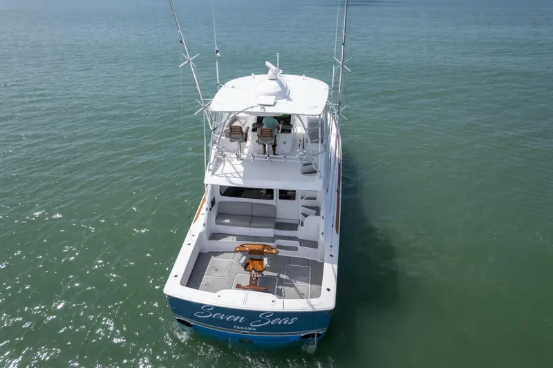 Seven Seas Yacht Photos Pics 2024 Viking 58 Convertible yacht on open water, rear view.