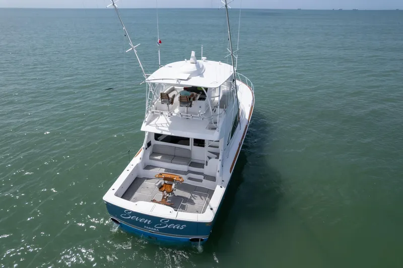 Seven Seas Yacht Photos Pics 2024 Viking 58 Convertible yacht on open sea, rear view, named "Seven Seas".