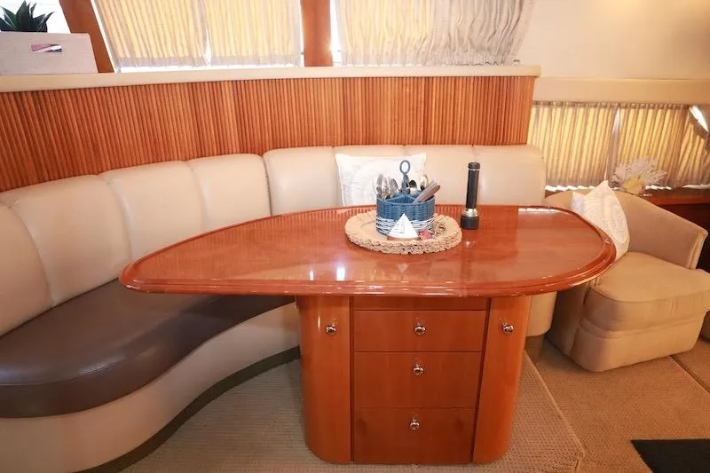Four Us Yacht Photos Pics Luxurious interior of 2006 Carver 42 Super Sport yacht with elegant dining area.