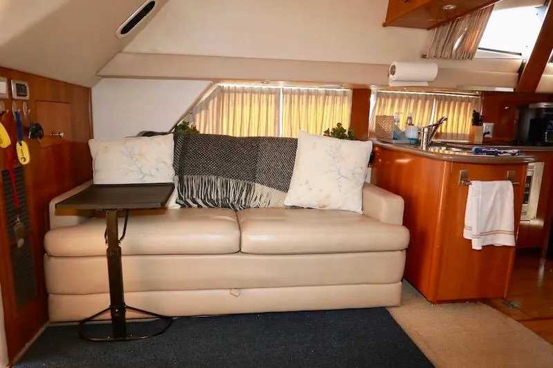 Four Us Yacht Photos Pics Interior of 2006 Carver 42 Super Sport yacht with cozy seating area.