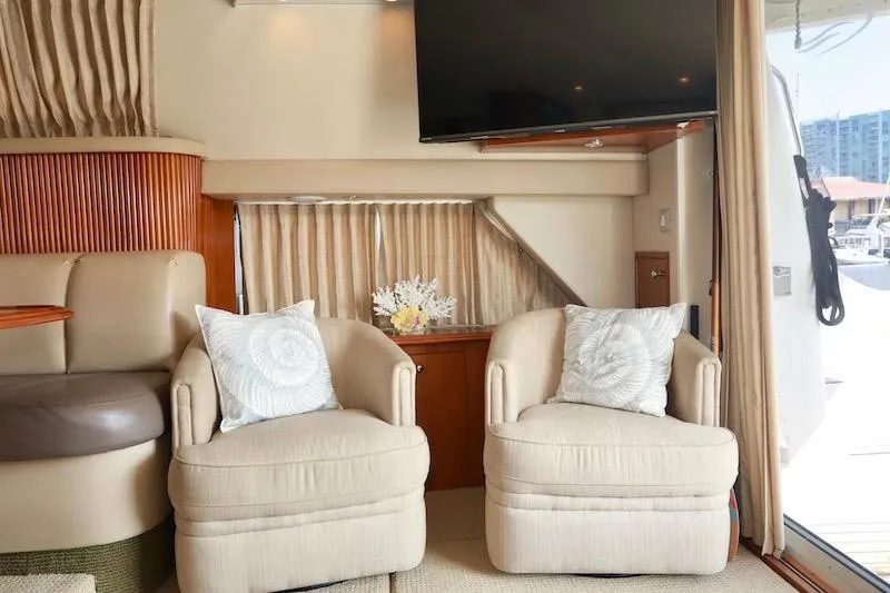 Four Us Yacht Photos Pics Interior of 2006 Carver 42 Super Sport yacht with plush seating and TV.