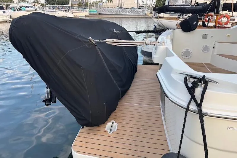 Four Us Yacht Photos Pics 2006 Carver 42 Super Sport yacht with covered outboard motor at marina.