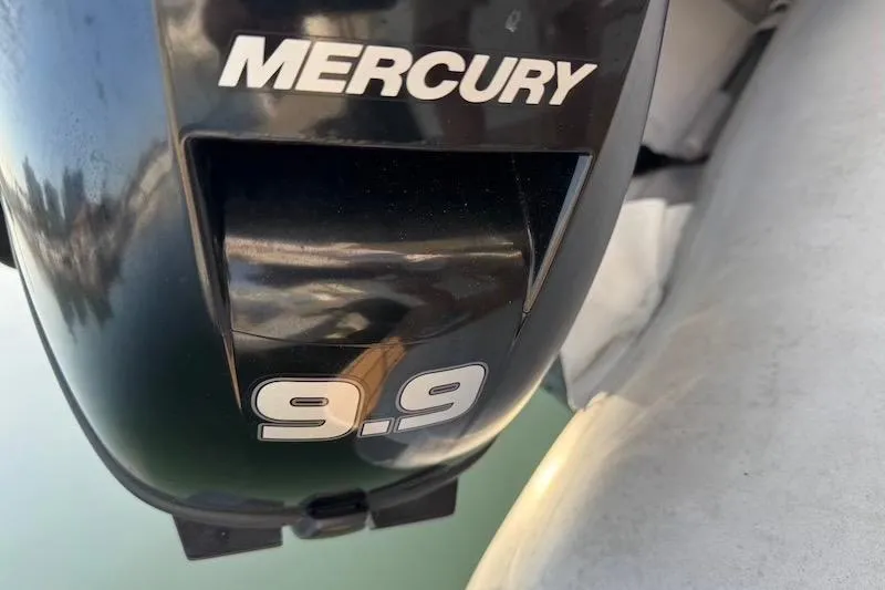 Four Us Yacht Photos Pics Mercury 9.9 outboard motor on a 2006 Carver 42 Super Sport boat.
