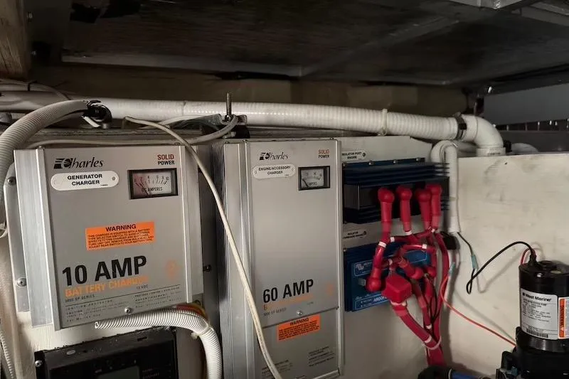 Four Us Yacht Photos Pics Electrical system of a 2006 Carver 42 Super Sport boat, featuring battery chargers and wiring.