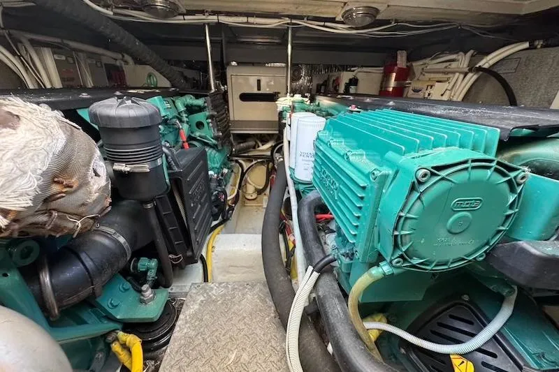 Four Us Yacht Photos Pics Engine room of a 2006 Carver 42 Super Sport yacht, showcasing mechanical components.