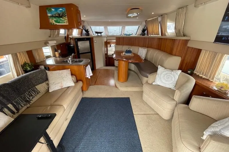 Four Us Yacht Photos Pics Luxurious interior of 2006 Carver 42 Super Sport yacht with modern furnishings.