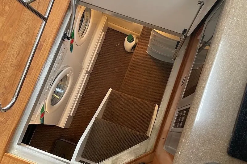 Four Us Yacht Photos Pics Laundry area in 2006 Carver 42 Super Sport yacht with washer and dryer.