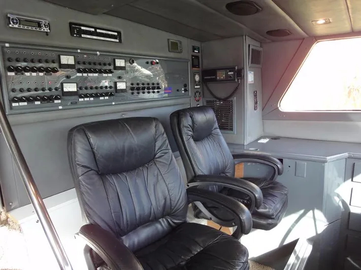 Pier Pressure Yacht Photos Pics Interior cockpit of 1990 Inace 88 Custom yacht with control panel and leather seats.