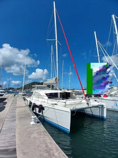 Andiamo IV Yacht Photos Pics 2018 Leopard 48 catamaran docked at marina under clear blue sky.